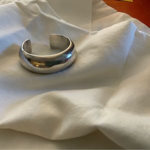 NA domed sterling silver Orville Tsinnie bracelet.